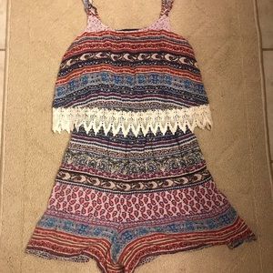 Super cute Romper blue/red with lace.